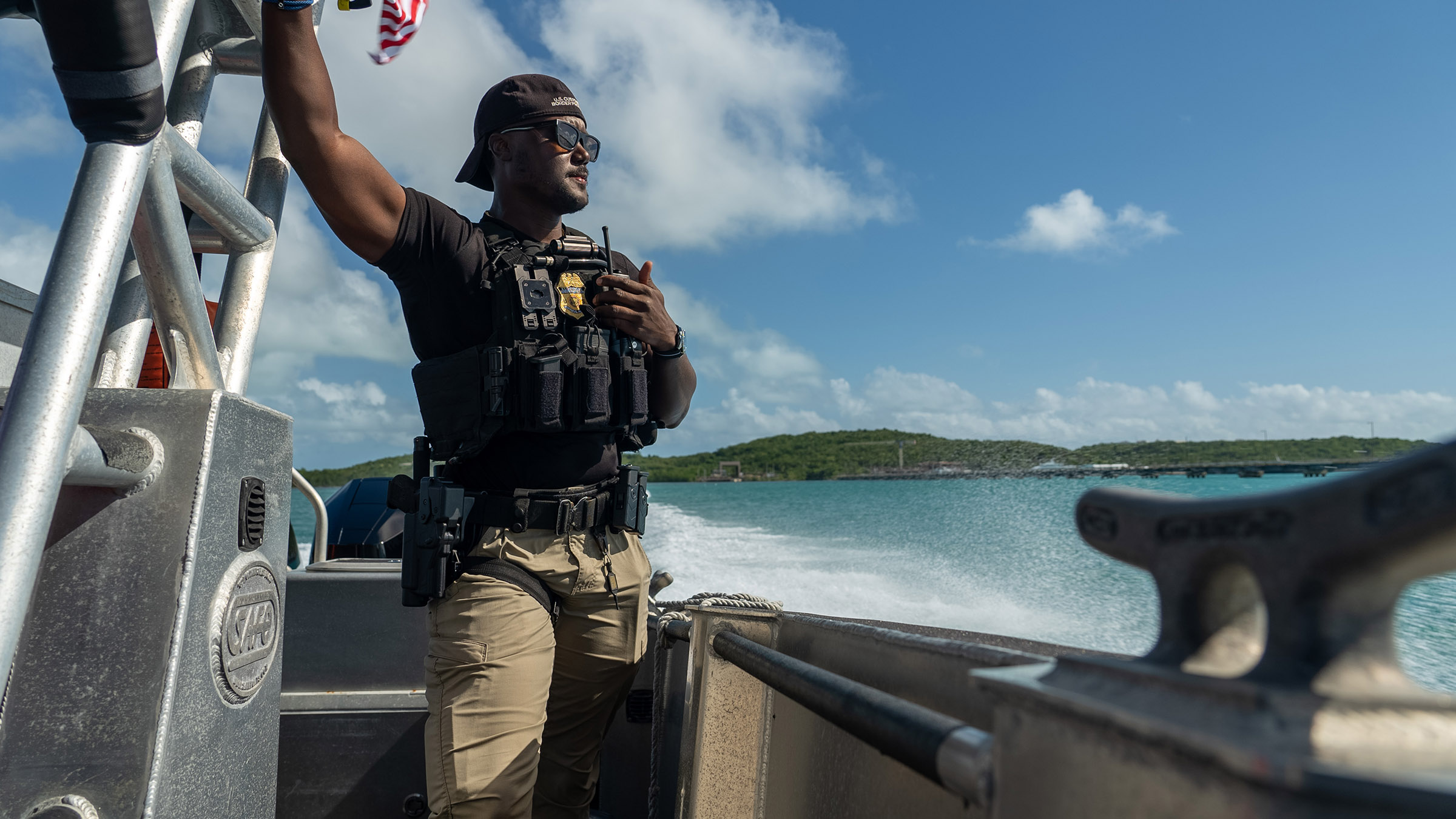 AMO Agent Smith stands on a boating vessel, looking out at the open water in Fajardo, Puerto... [Photo of the day - August 2025]