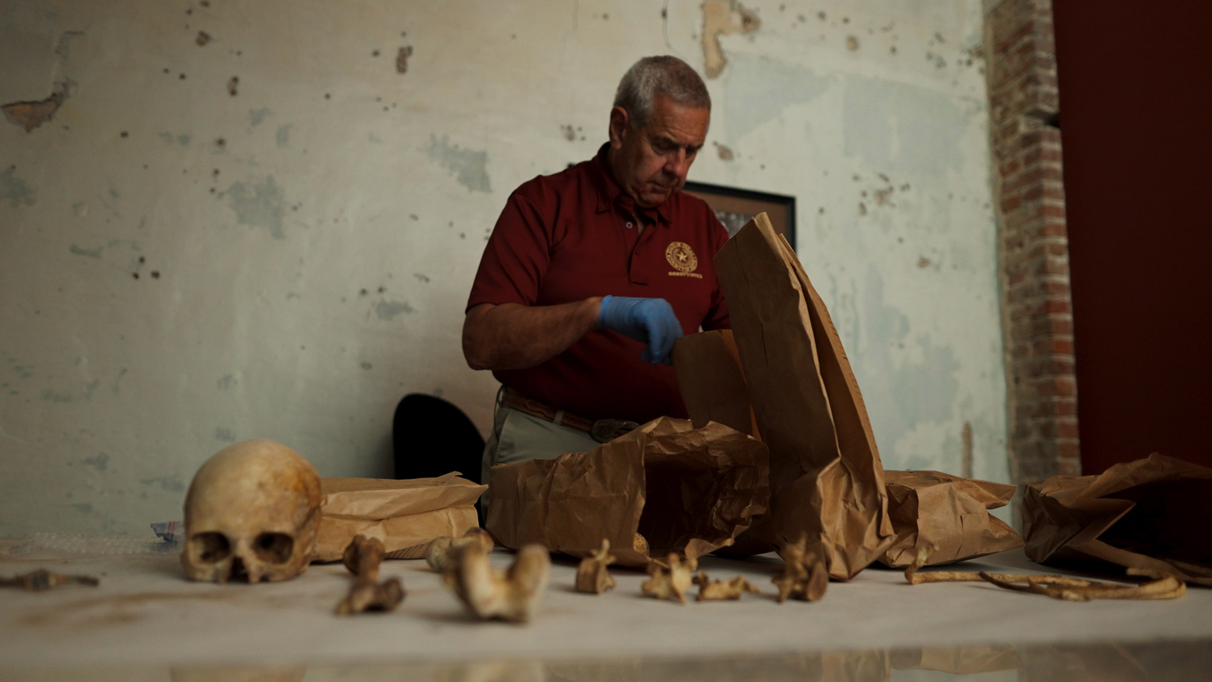 Detective David Turner of Smith County Sheriff's Office lays out Jane Doe's skeletal remains.... [Photo of the day - August 2025]