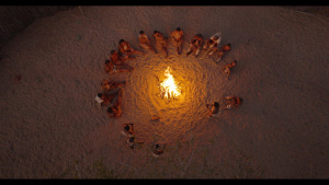 Will and The San sit around a camp... [Photo of the day - 29 JANUARY 2026]