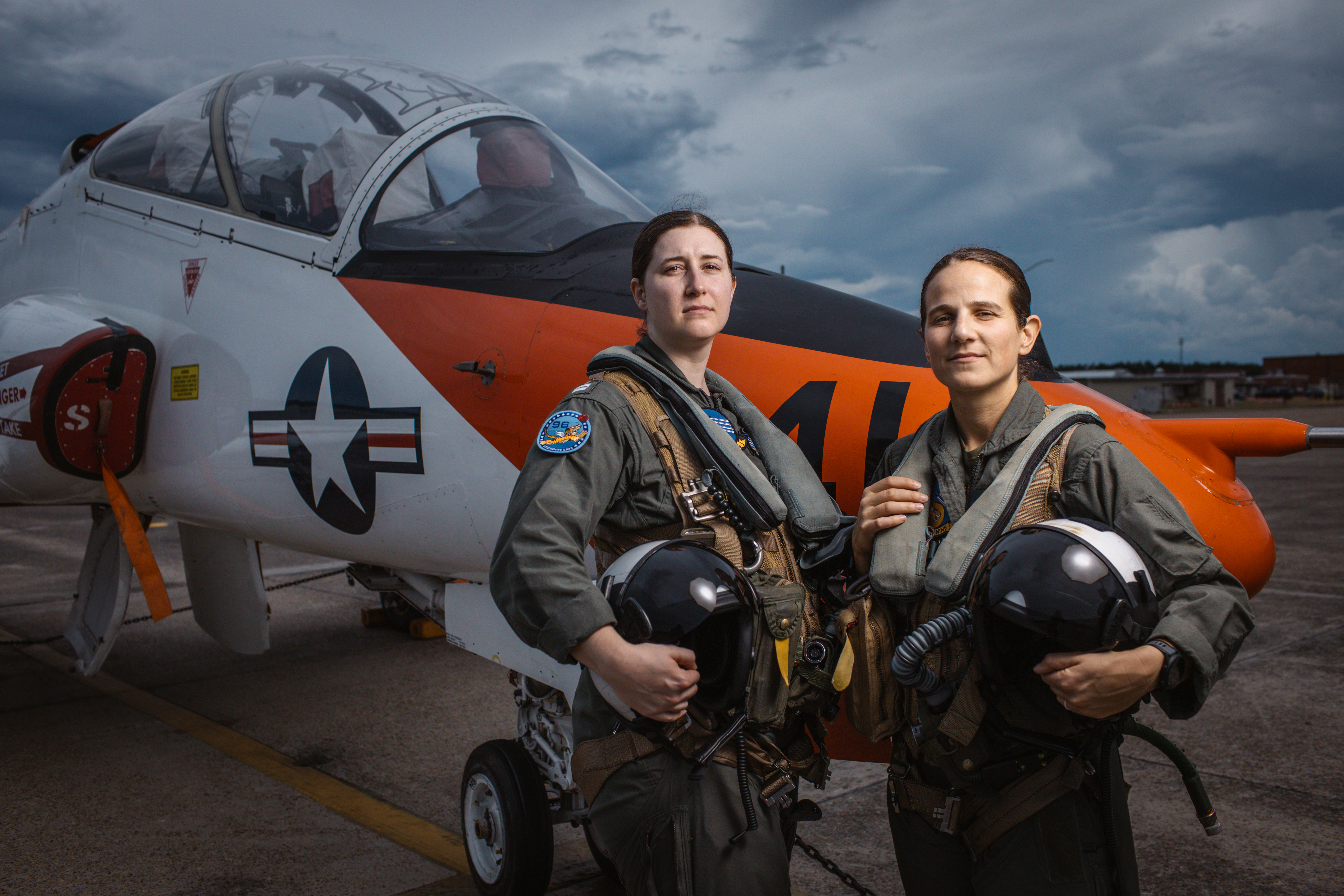Student LT Carissa Mienster and student Captain Steph Harris pose in front of a T-45. [Photo of the day - February 2026]
