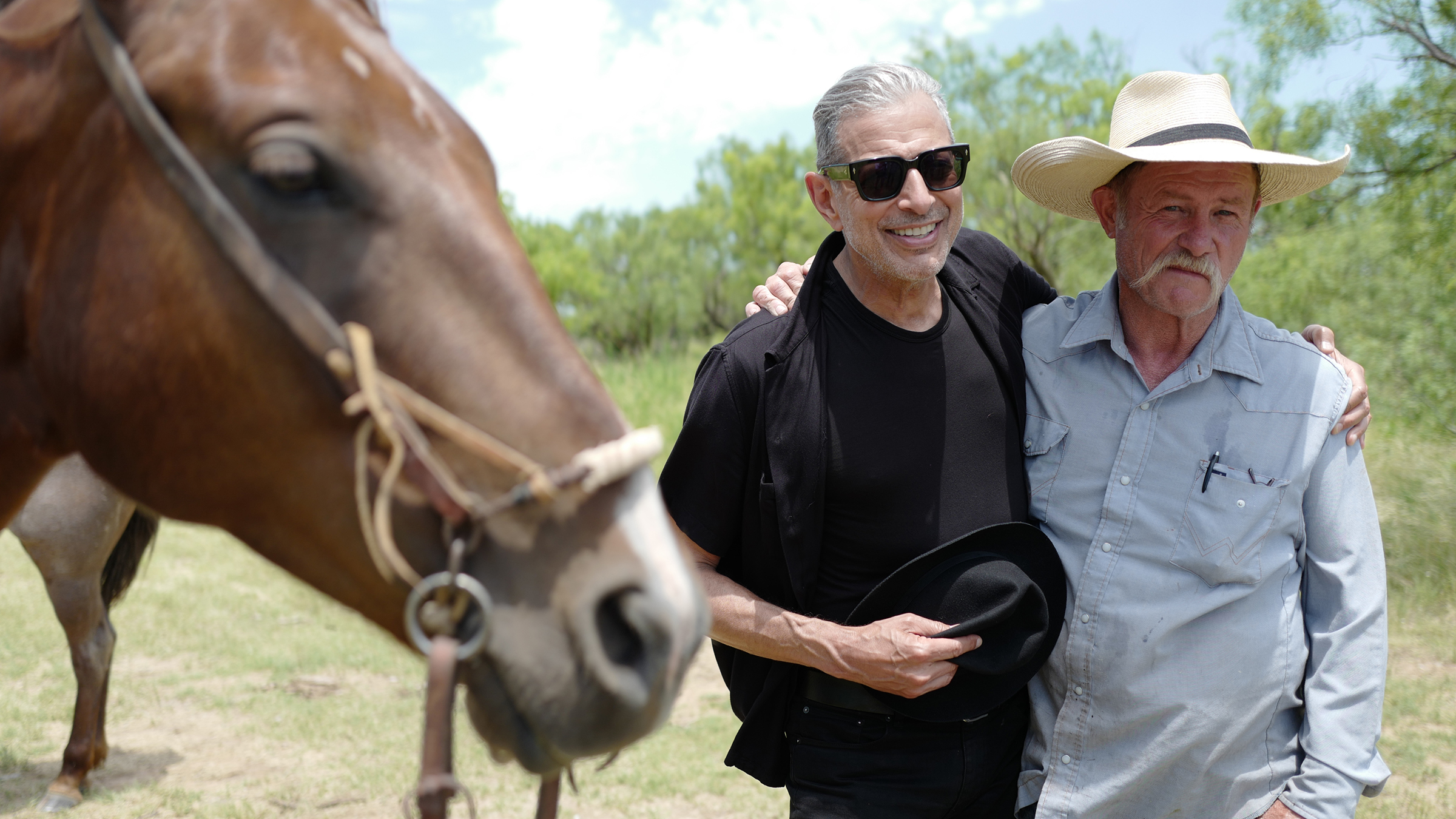 Jeff Goldblum (L) learning how to make 'cowboy' coffee at a cattle ranch with cowboy Kent Rollins. [Photo of the day - March 2026]