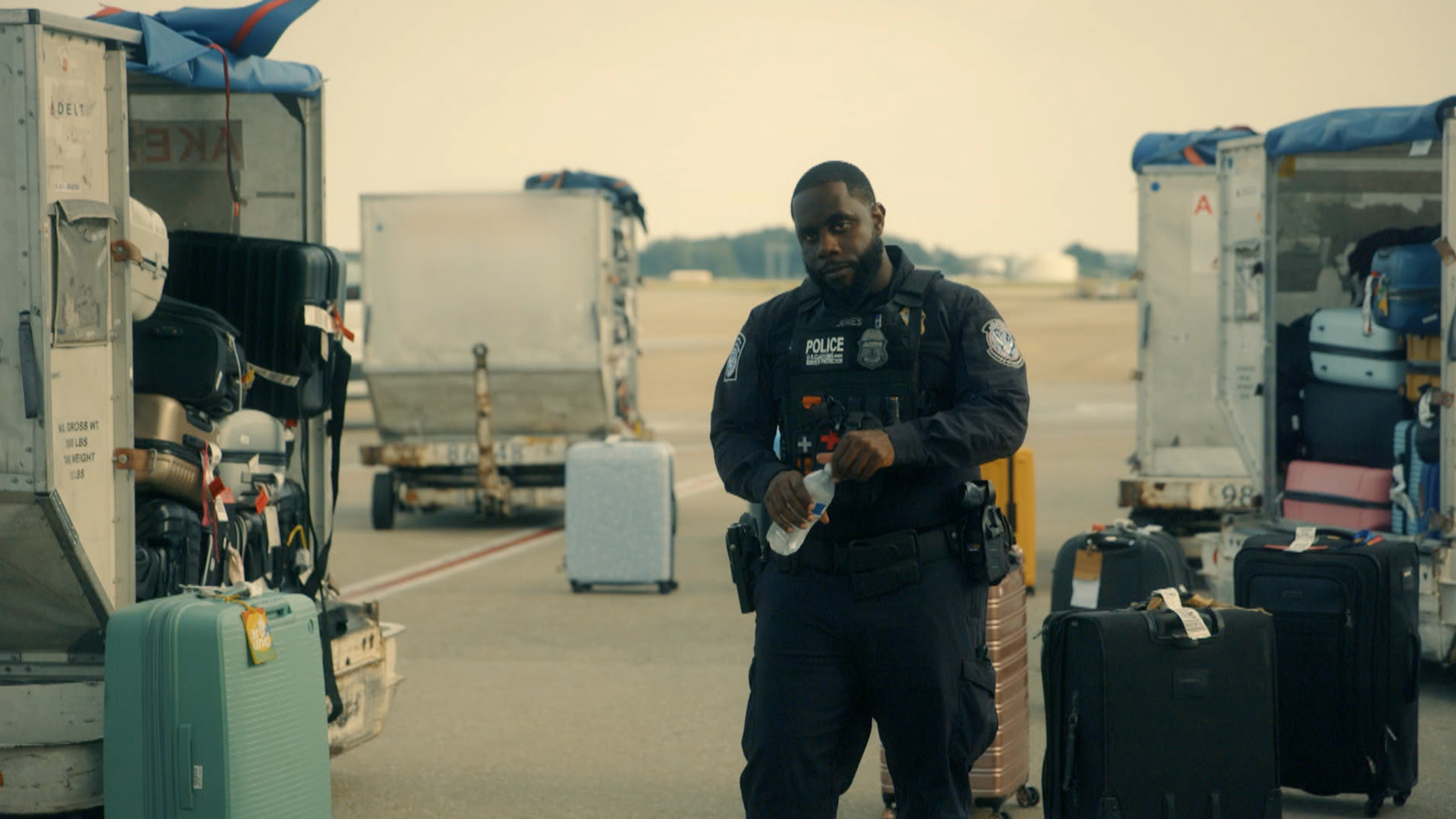 Agent Jones assists with the search for smuggled goods amongst luggage in Atlanta airport. [Photo of the day - April 2026]