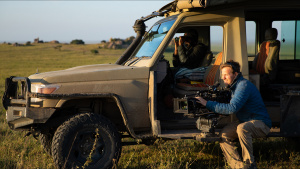 Bertie Gregory sits next to a safari... [Photo of the day - 13 MAY 2026]
