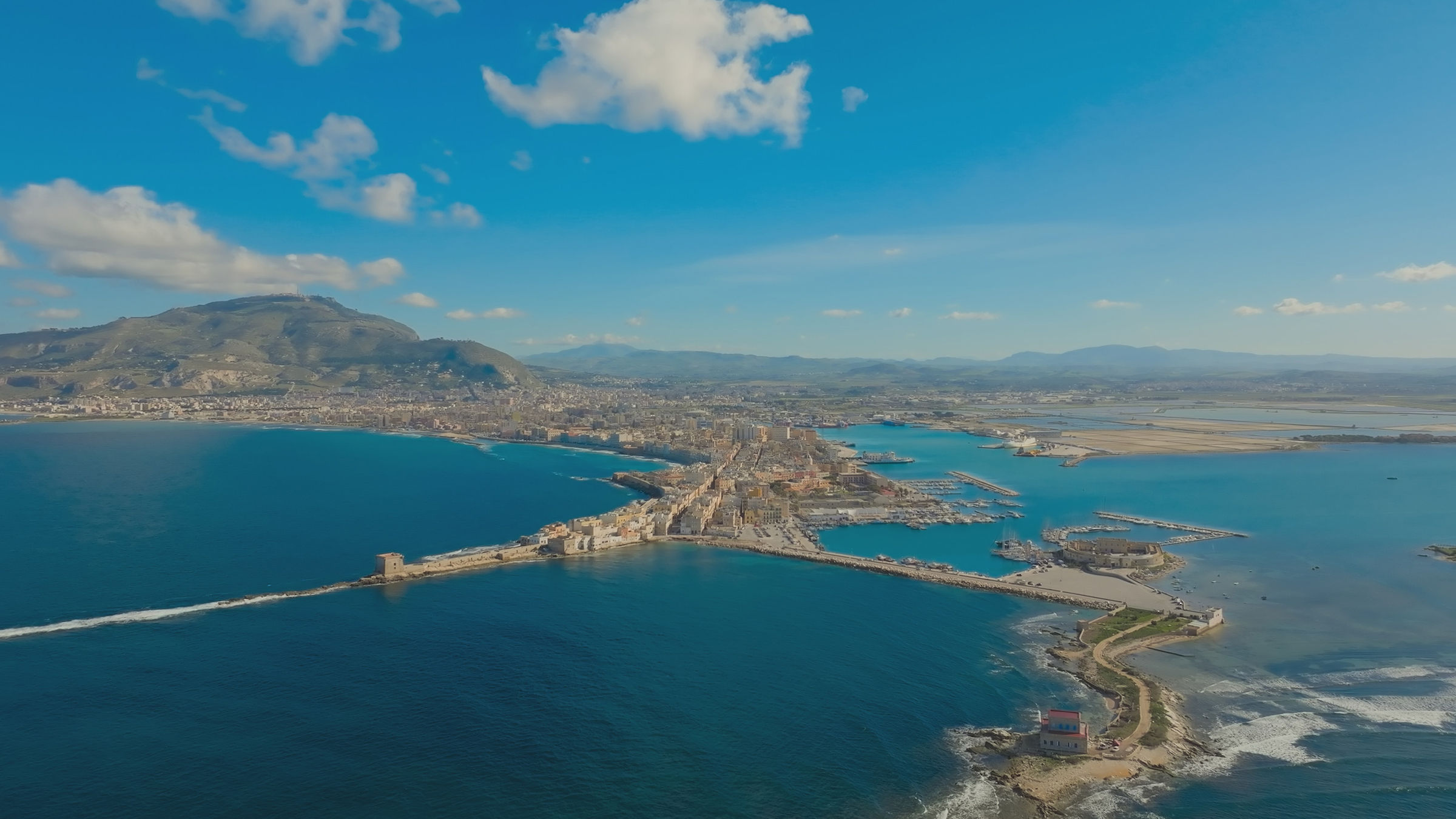 Aerial view of Trapaniâs old port with Mount Erice rising in the background. [Photo of the day - May 2026]