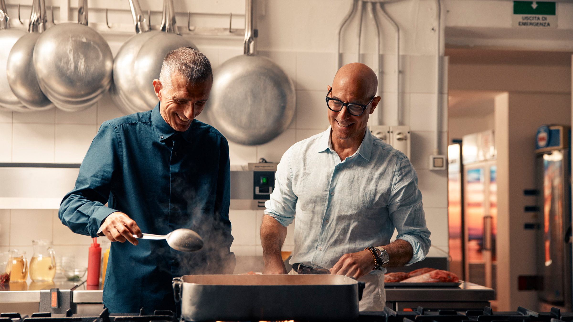 Stanley Tucci in the kitchen of Da Tonino with Giuseppe Bertoleoni, the heir to the throne of... [Photo of the day - June 2026]